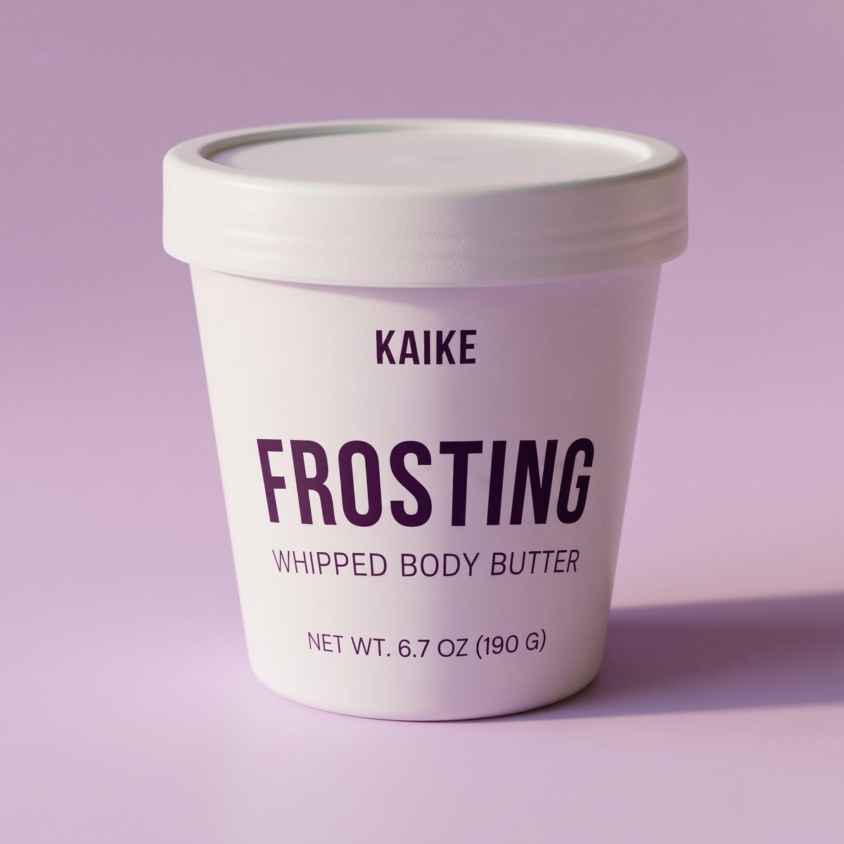 A white jar of KAIKE Frosting Whipped Body Butter on a solid light purple background.